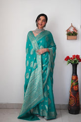 Radiant Teal Banarasi Silk Saree with Intricate Silver Zari Weaving