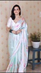 Ethereal Sky Blue Satin Silk Saree with Pastel Floral Prints & Pearl Lace Border