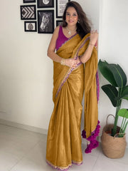 Elegant Mustard Gold Silk Saree with Magenta Contrast Border and Pom-Pom Tassel Detail