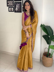 Elegant Mustard Gold Silk Saree with Magenta Contrast Border and Pom-Pom Tassel Detail