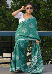 Forest Green Mulmul Saree with White Discharge Prints and Contrasting Puff-Sleeve Blouse Styling