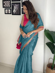 Elegant Teal Metallic Shimmer Saree with Magenta Scalloped Border & Pom-Pom Tassels