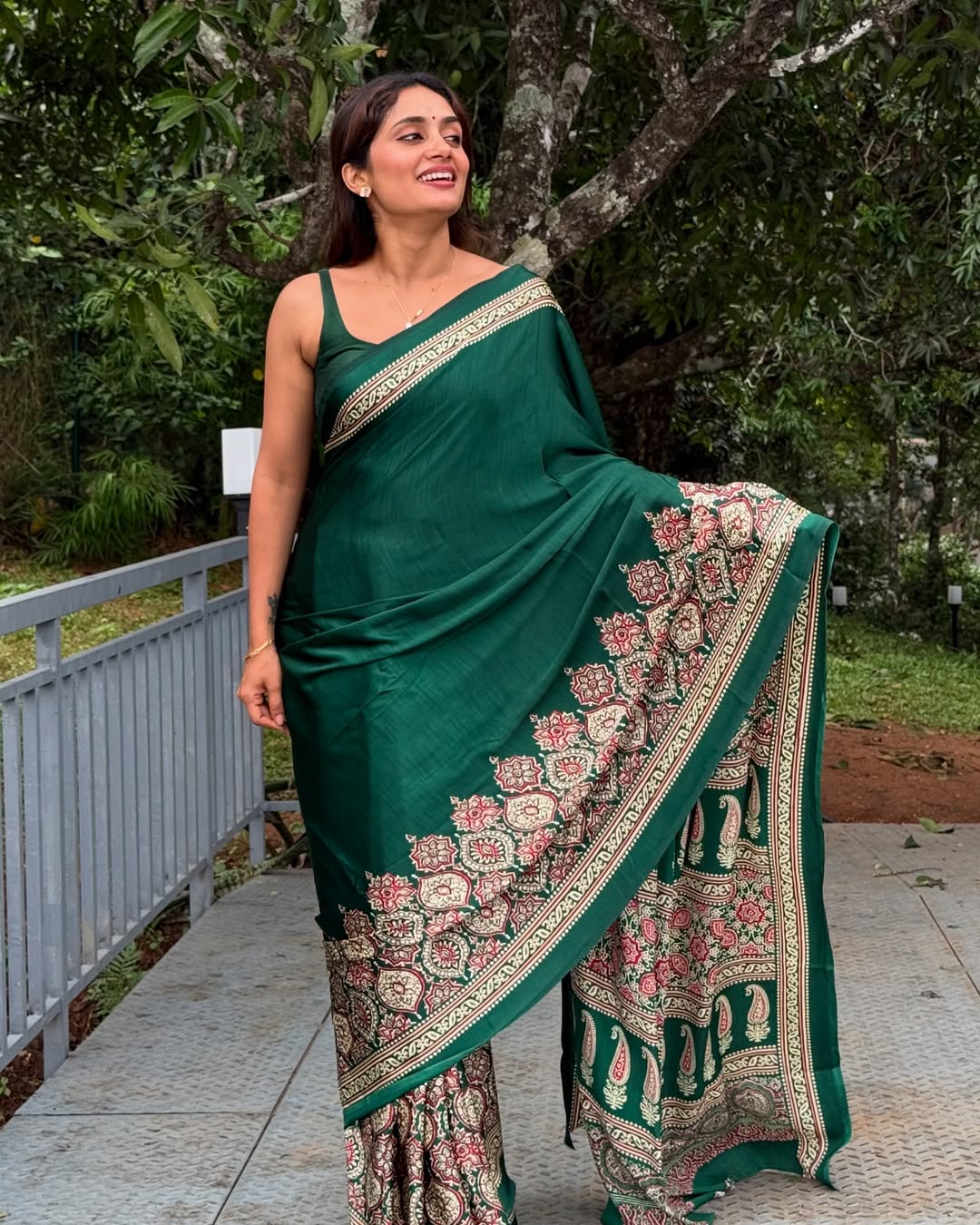Green Crepe Saree with Kalamkari Print Border & Minimalist Sleeveless Blouse