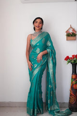 Radiant Teal Banarasi Silk Saree with Intricate Silver Zari Weaving