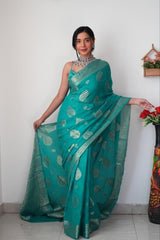 Radiant Teal Banarasi Silk Saree with Intricate Silver Zari Weaving
