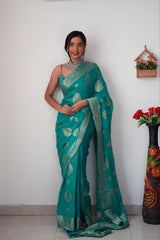 Radiant Teal Banarasi Silk Saree with Intricate Silver Zari Weaving