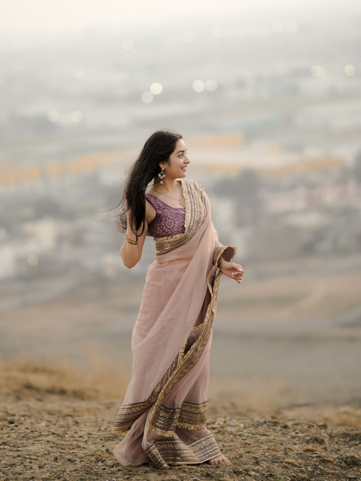 Elegant Rose-Gold Organza Saree with Embroidered Velvet Blouse and Heavy Zari Border