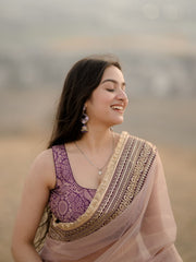 Elegant Rose-Gold Organza Saree with Embroidered Velvet Blouse and Heavy Zari Border