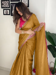 Elegant Mustard Gold Silk Saree with Magenta Contrast Border and Pom-Pom Tassel Detail